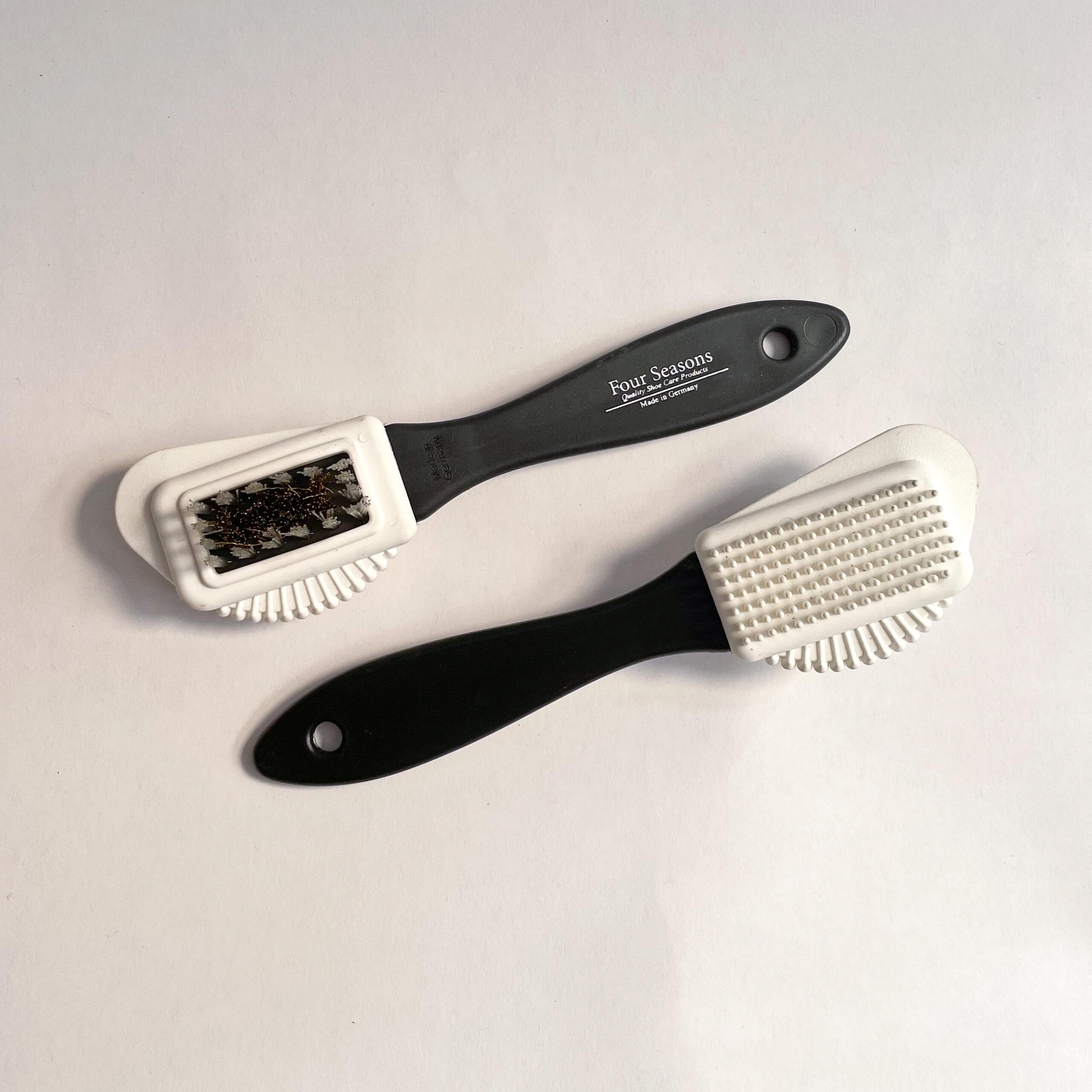 Two Suede Combi brushes laying side by side and diagonal angle